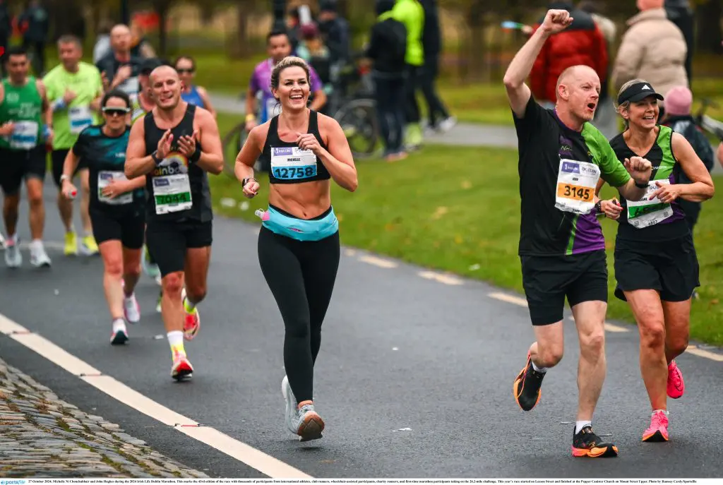 Runners during the Dublin Marathon, nearing the finish line and full of excitement